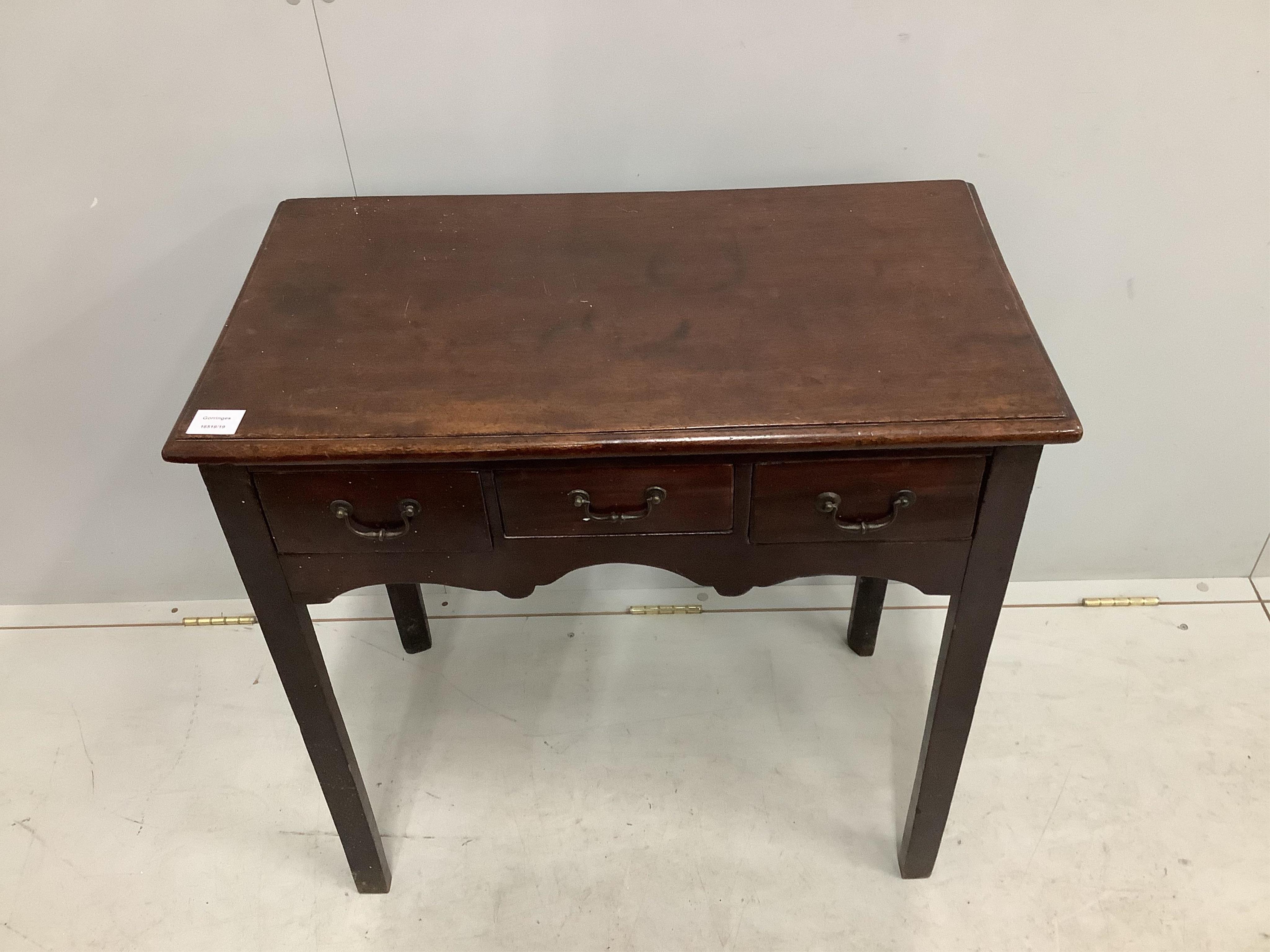 A George III rectangular mahogany three drawer side table, width 74cm, depth 41cm, height 73cm. Condition - fair